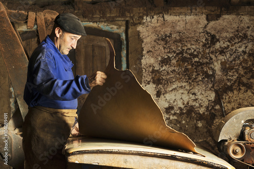 Billede på lærred traditional  tanner  with old tools and machinery  in the antique tannery