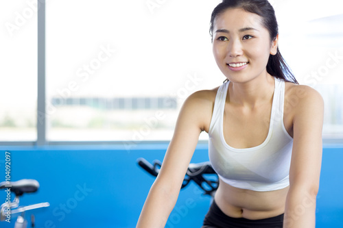 beautiful girl working out in modern gym