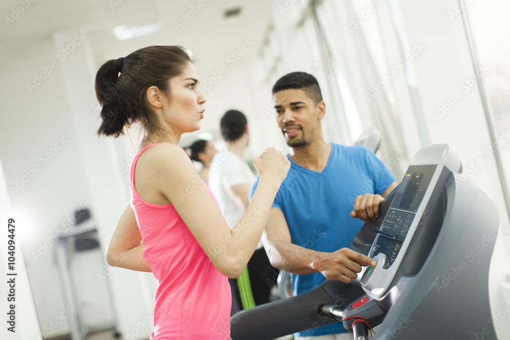 Young people training in the gym Young people training in the gym