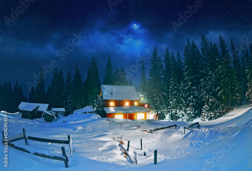 Wooden house in winter forest , Carpathian,Ukraine