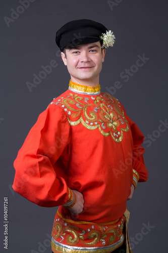 attractive caucasian guy wearing a russian folk costume