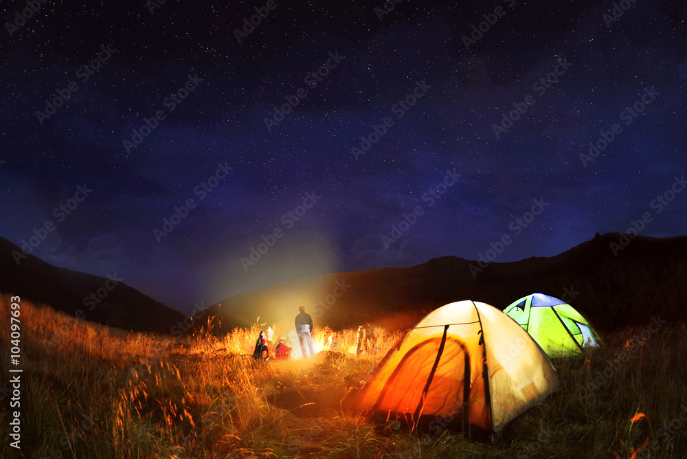 Camping under the stars at night