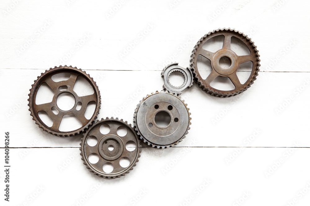 Cogwheels machinery , engineering and industry or concepts such as teamwork and search engine on white background Cogwheels machinery , engineering and industry or concepts such as teamwork and search engine on white background