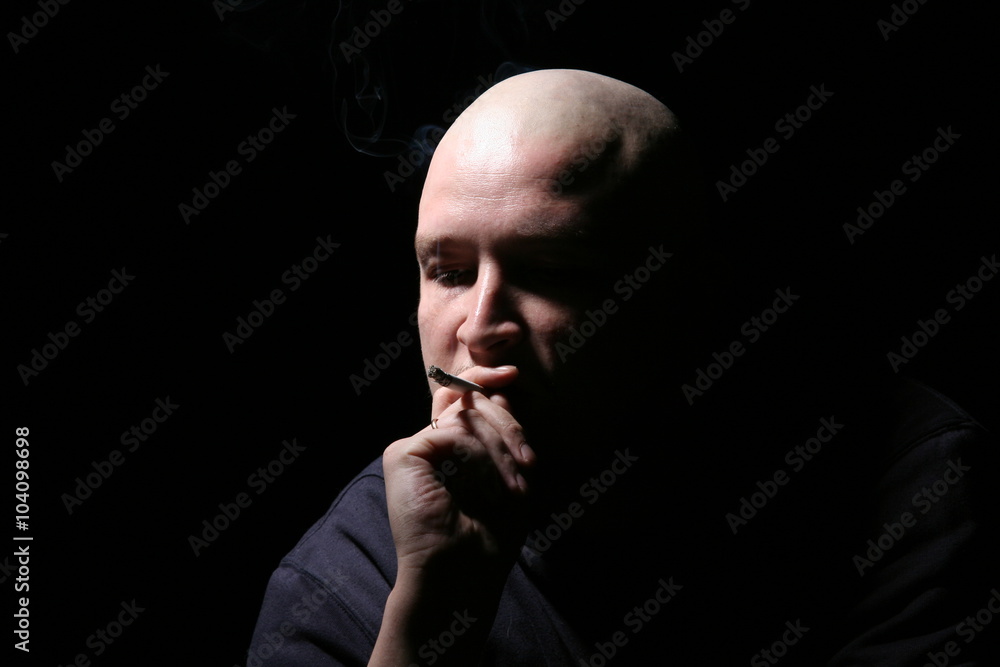 The bald man with a cigarette The bald man with a cigarette