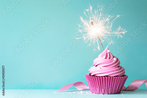 Pink cupcake with sparkler photo