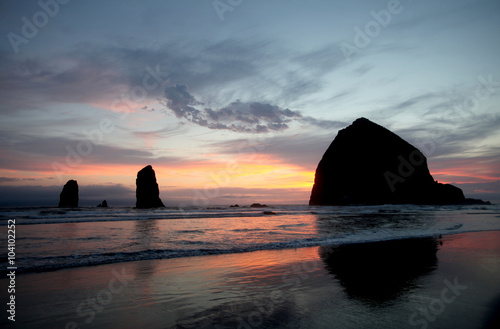 A brilliant sky creates the backdrop for the imposing Haystack Rock in the Pacific Ocean off Cannon Beach on Oregon’s northern coastline.