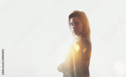 Portrait of businesswoman  visual effects  flare. Blurred city background. Isolated