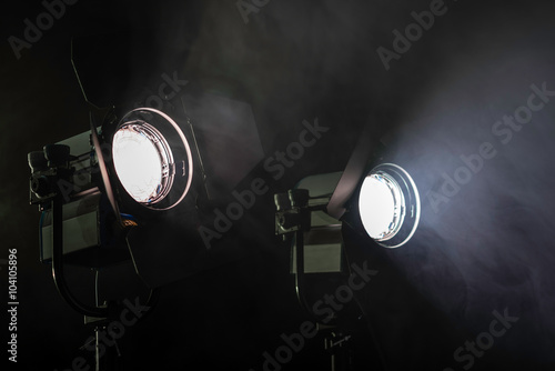 Two lights in smoke. Two studio lights shining through the smoke from smoke machine. photo