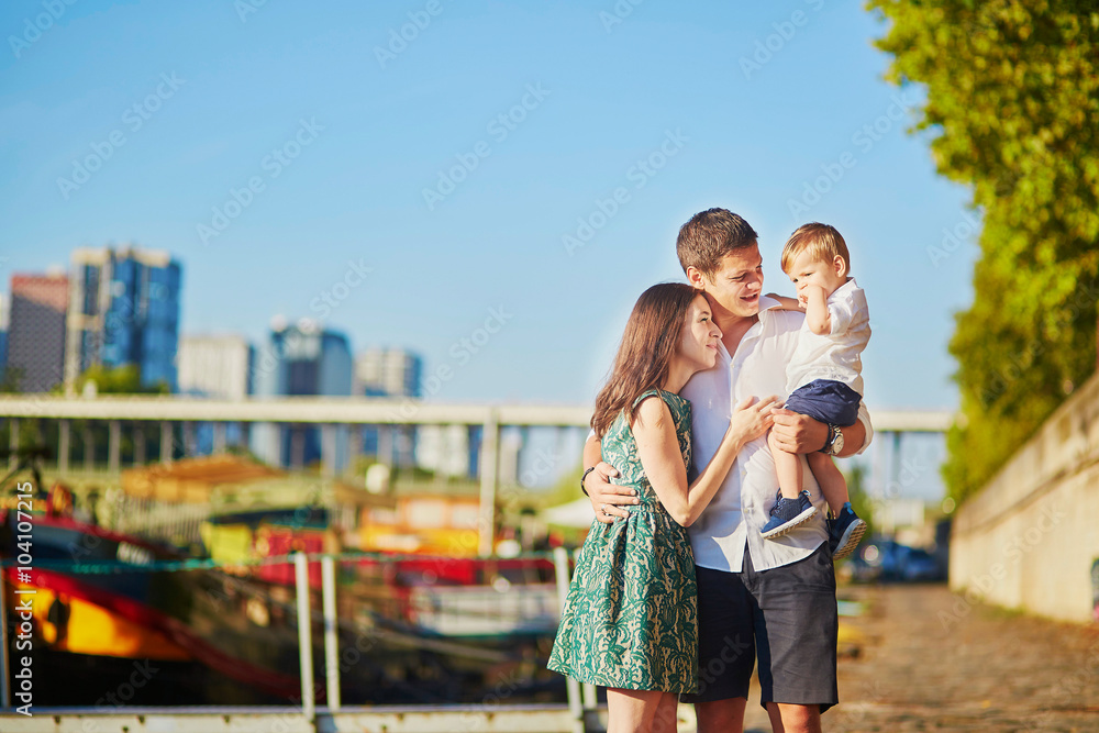 Happy family of three enjoying their vacation in Paris Happy family of three enjoying their vacation in Paris