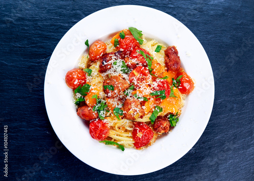 Sausage Pasta spaghetti with summer vegetables, cheese