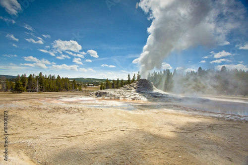 castle geyser eruption of steam from geothermal landscape