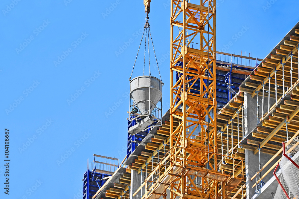 Crane lifting cement mixing container