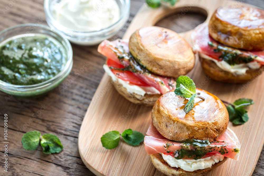 Mushroom burgers with jamon, cream cheese and mint sauce Mushroom burgers with jamon, cream cheese and mint sauce