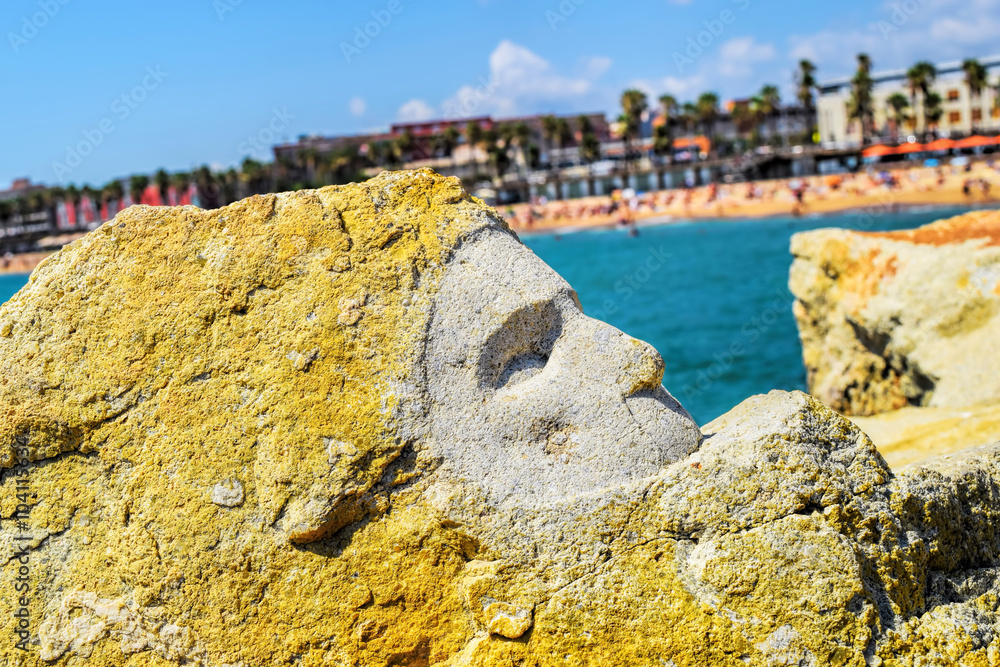 Face from the rock, Barcelona beach, sculpture