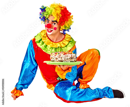 Clown man keeps cake on birthday . Isolated.