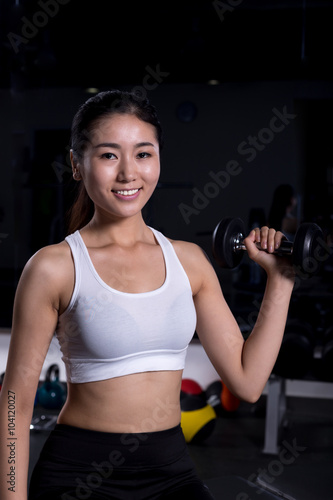 beautiful girl working out in moder gym