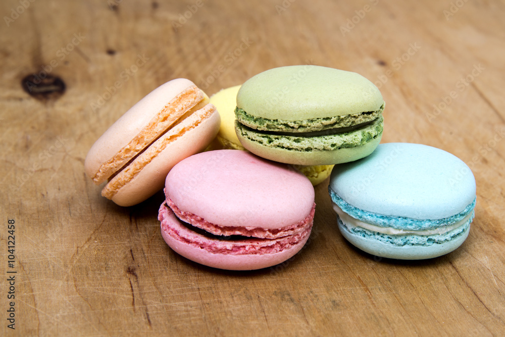 French Macaroons on a wooden background French Macaroons on a wooden background