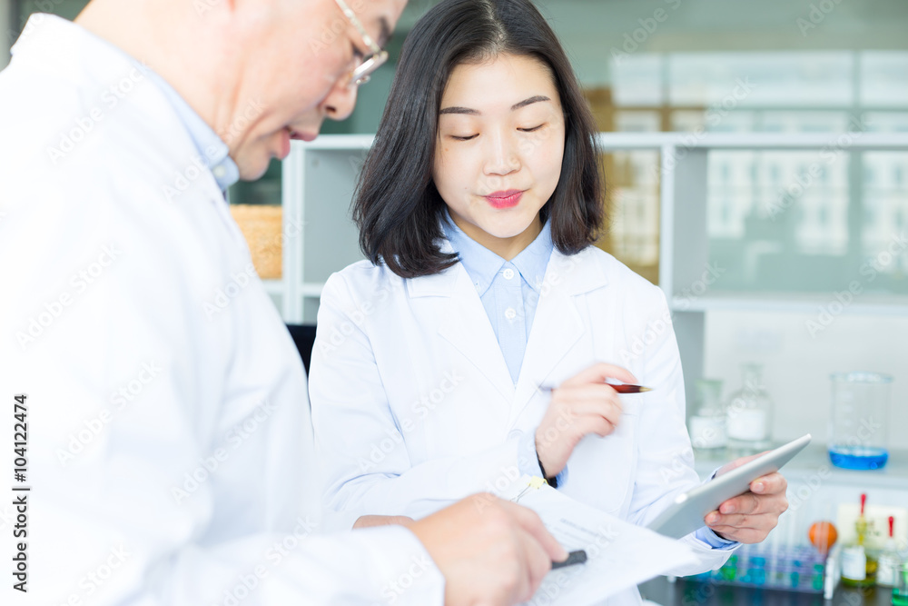 people doing chemical experiment in modern lab people doing chemical experiment in modern lab