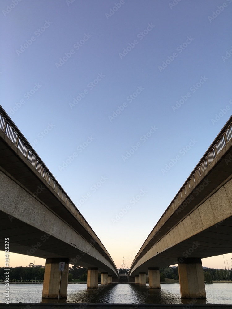 Blue sky over lake water and bridge Blue sky over lake water and bridge