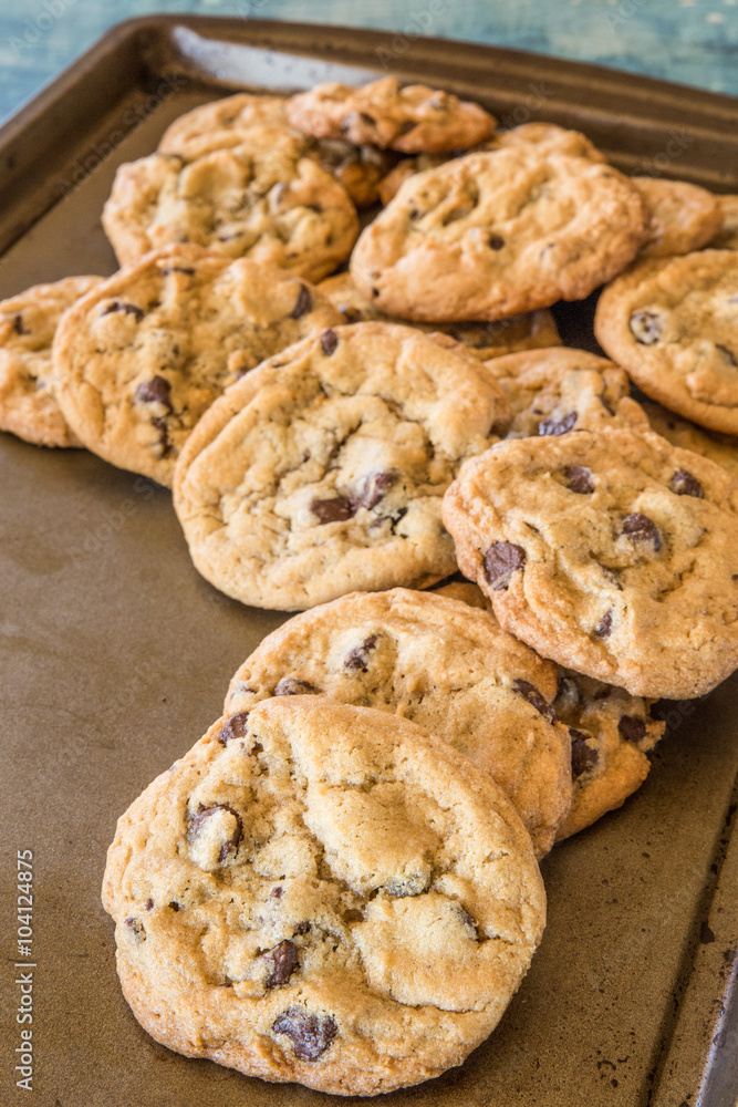 batch of homemade chocolate cookies on baking sheet 