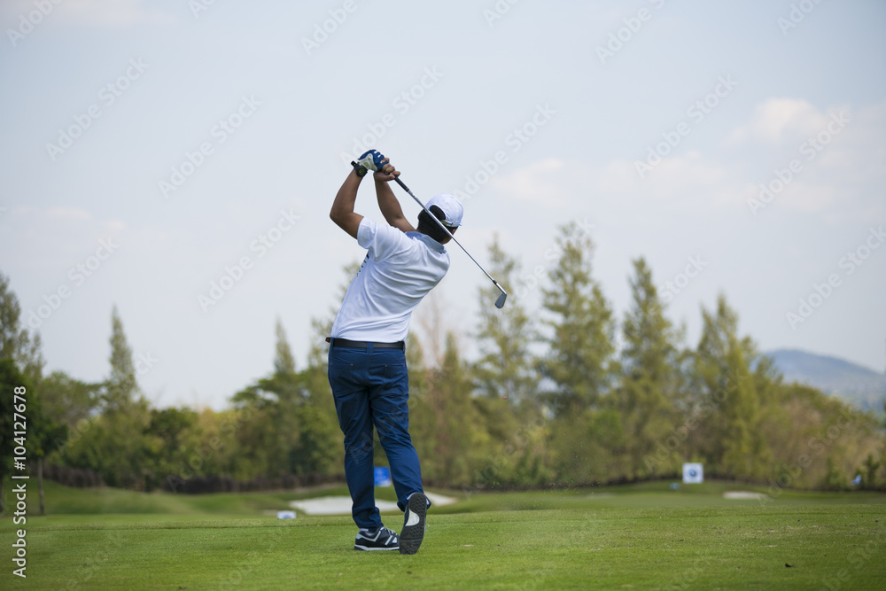 Golfers hit sweeping golf course in the summer Golfers hit sweeping golf course in the summer