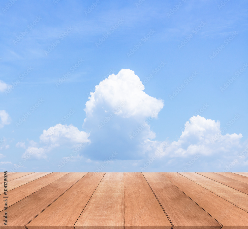 Wood table top on blue sky background - used for display your products