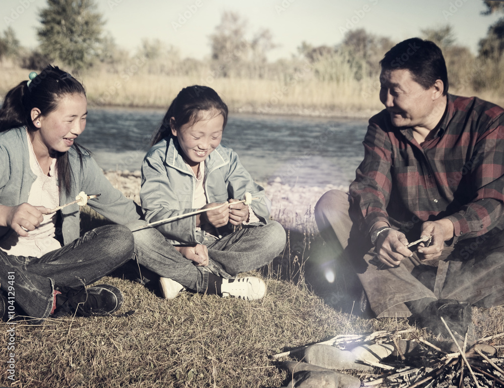 Mongolian Family Enjoy Camping River Leisure Concept