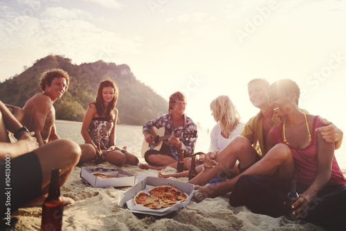 Group of friends having a summer beach party Concept