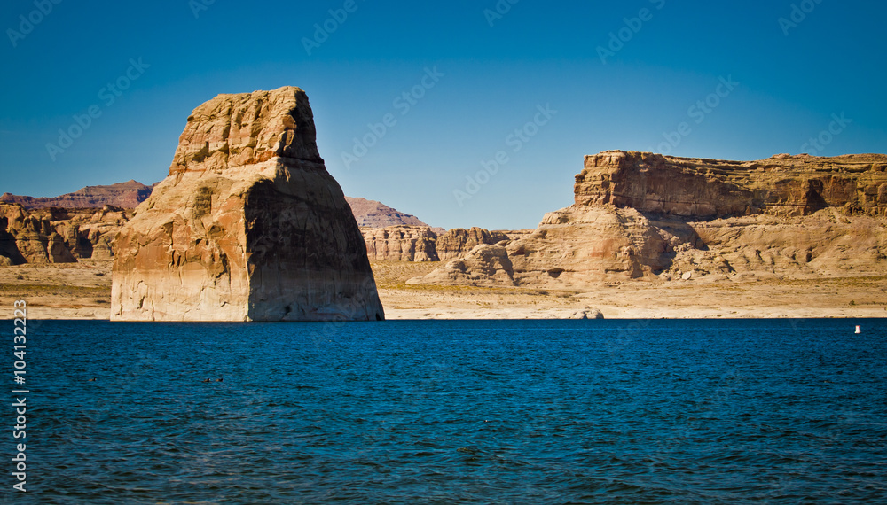 lone rock formation in lake powell