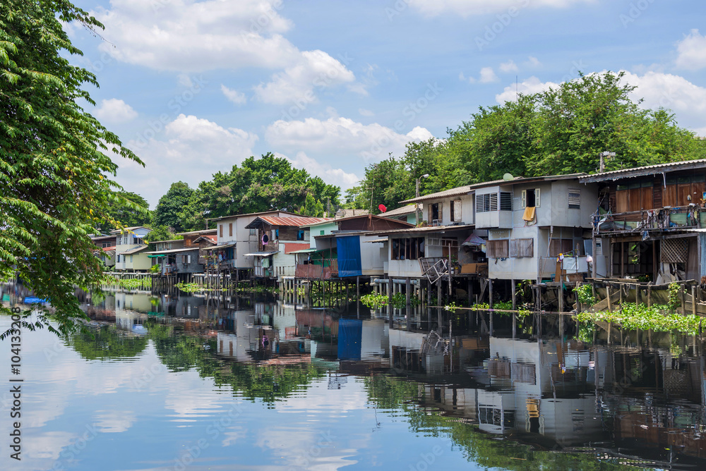 Wooden houses along the canals in Thailand