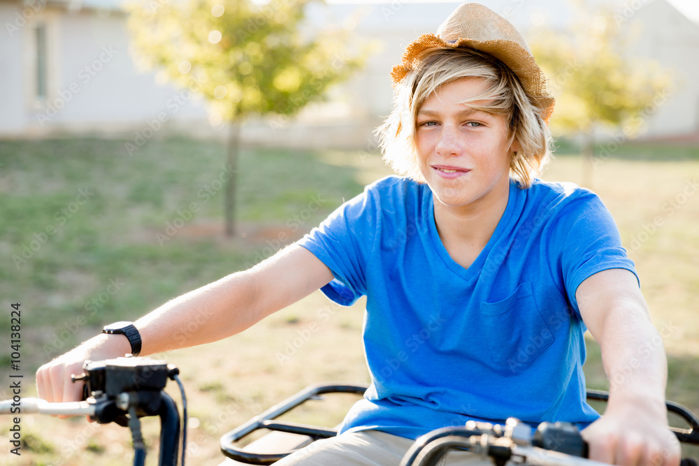 Boy riding farm truck in vineyard Boy riding farm truck in vineyard