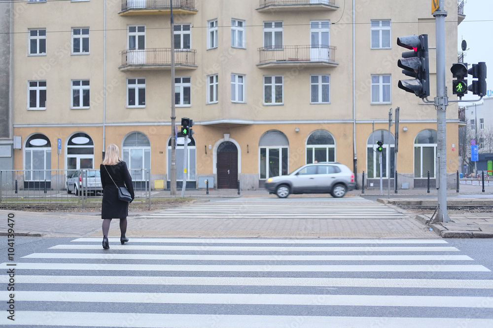 Warsaw, Poland - February 14, 2016: pedestrian cross road in Warsaw, Poland