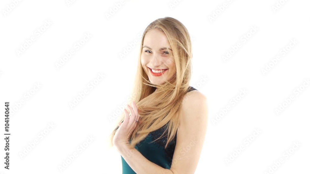 Attractive woman in beautiful dress smiling, dancing, wind blownig on white, slow motion Attractive woman in beautiful dress smiling, dancing, wind blownig on white, slow motion