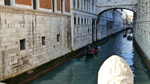 VENICE, ITALY - JANUARY 24, 2016: Tourists with gondola in Venice, of different nationalities.