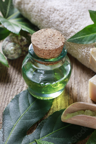 Bottle of green essential oil