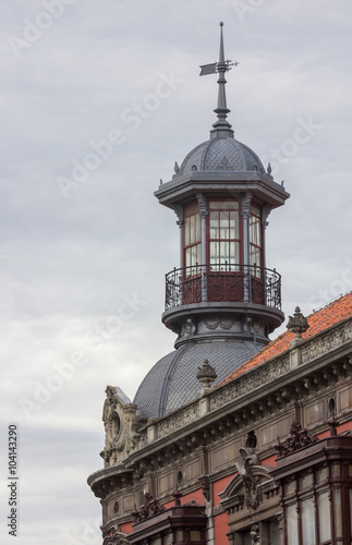 Glass gazebo on the roof of an old building in Aviles, Spain © james633