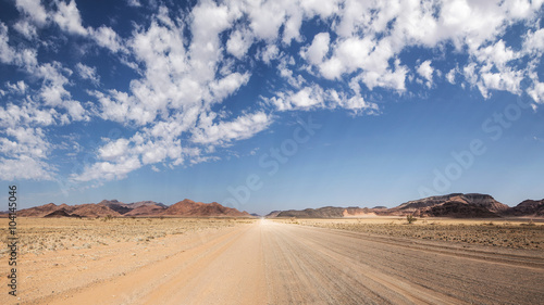Namibian typical street with beautiful clouds 