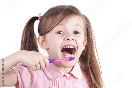 little girl cleaning teeth with tooth brush. Isolated white background.