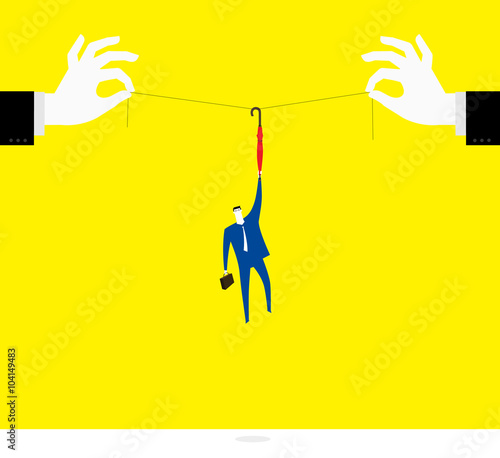Boss's toy / A business man was hanging helplessly in the air.