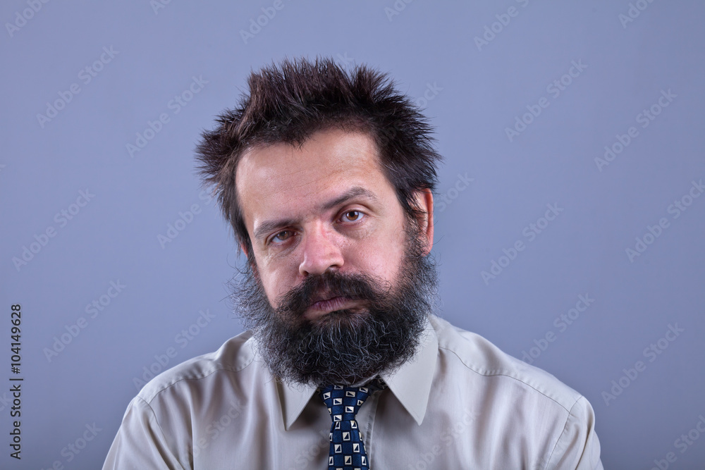 Exhausted man with bushy hair and beard Exhausted man with bushy hair and beard