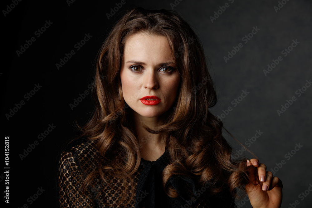 Portrait of woman with long wavy brown hair and red lips Portrait of woman with long wavy brown hair and red lips