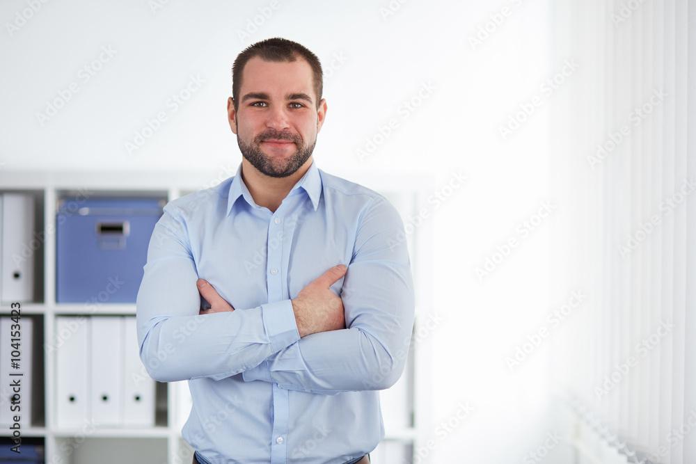 Businessman stands in the office