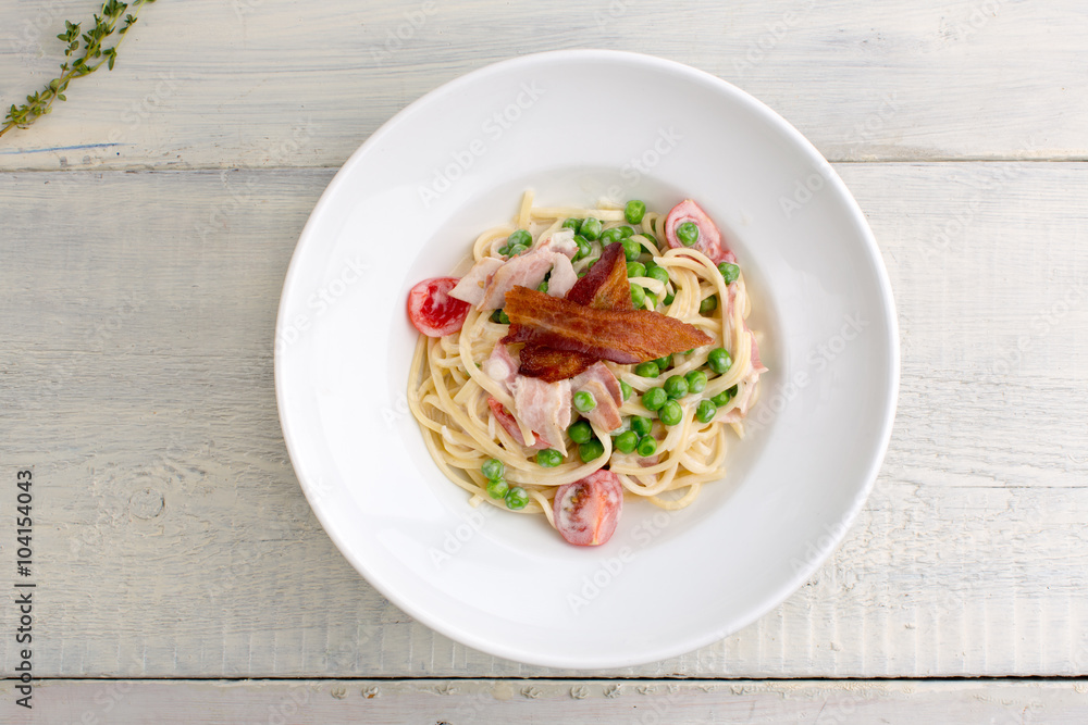 plate of pasta bacon, cheese, cherry tomatoes plate of pasta bacon, cheese, cherry tomatoes