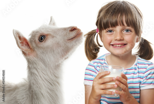 little girl drinking goat milk