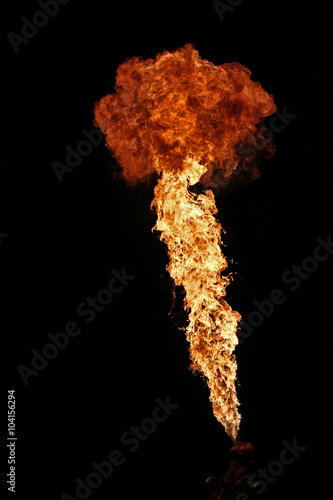 Fire artist performing fire breathing