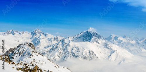 beautiful winter snow covered peaks of Dombaj mountain  panorama