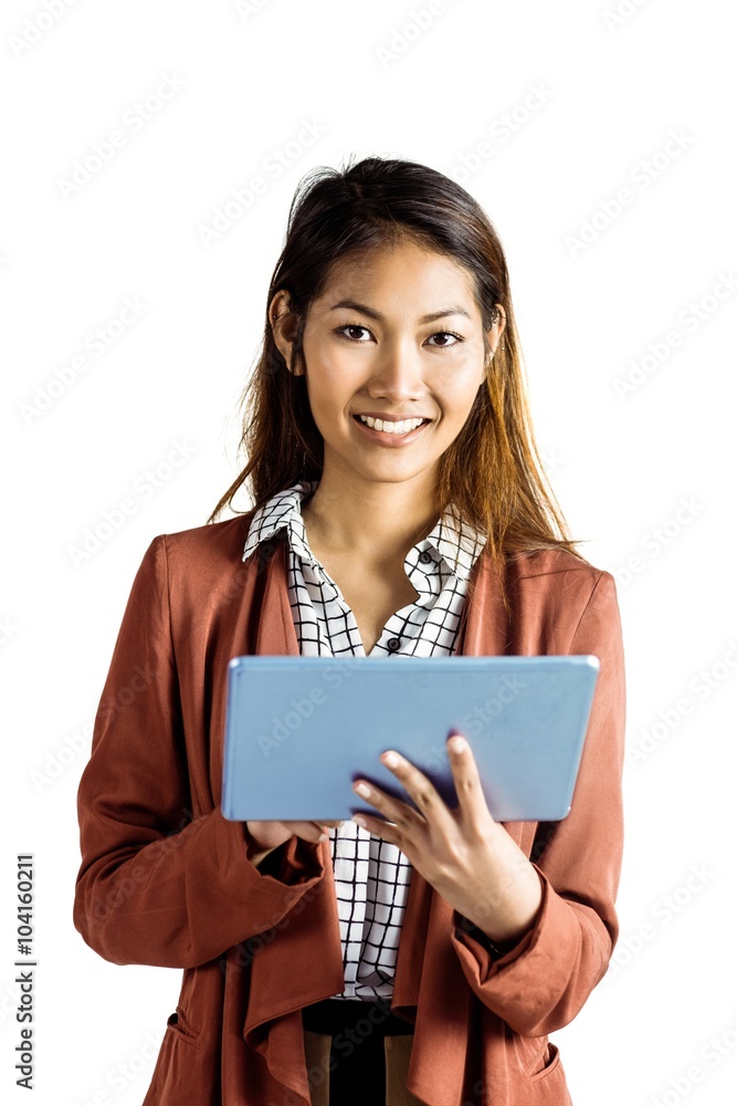 Smiling businesswoman using a tablet Smiling businesswoman using a tablet