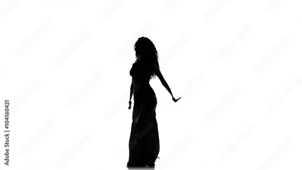 Talanted long-haired exotic belly dancer girl continue dance on white, silhouette Talanted long-haired exotic belly dancer girl continue dance on white, silhouette