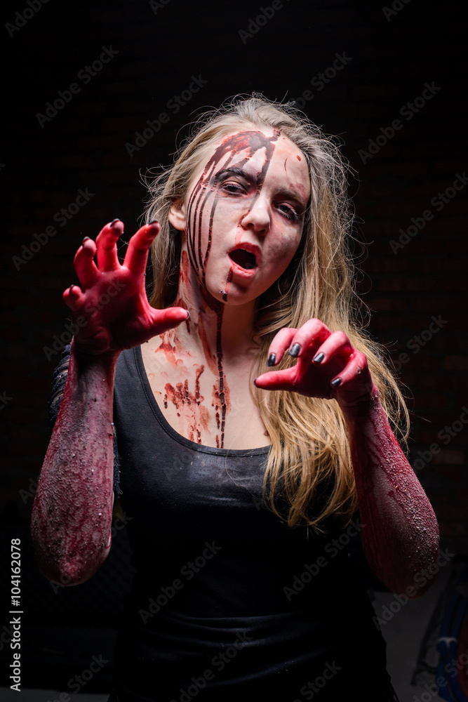 Portrait Of A Scared Girl With Blood On Her Face Looking At Camera