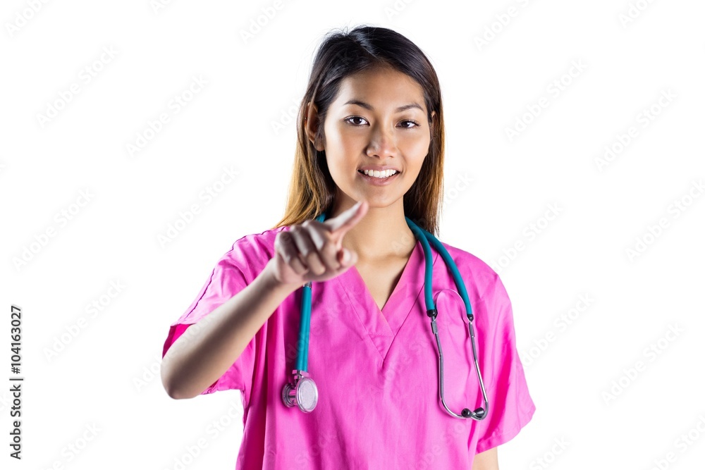 Asian nurse with stethoscope pointing in front of her Asian nurse with stethoscope pointing in front of her